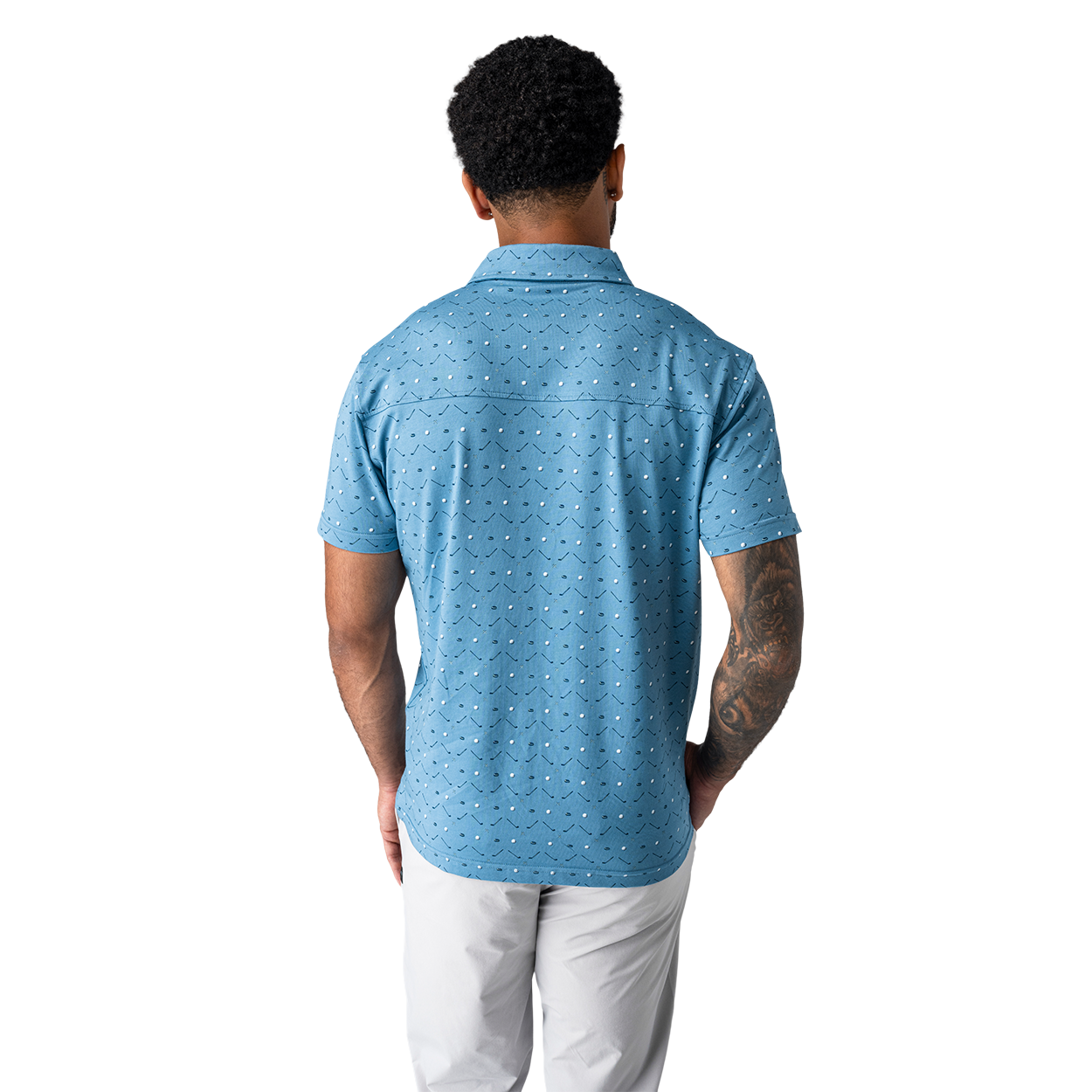 Man wearing a blue patterned polo shirt on a white background