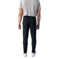 Person wearing black pants and a striped shirt on a white background