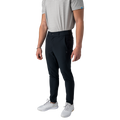 Person wearing black pants and white shoes on a white background